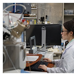 Mass balance researcher at her computer