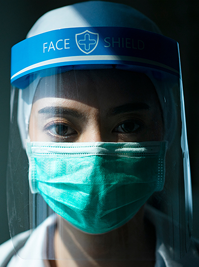 Medical professional wearing PPE to combat COVID-19